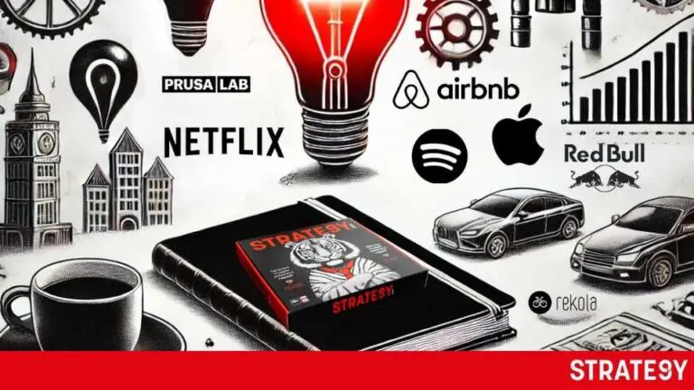 a black box with a red light bulb and a book